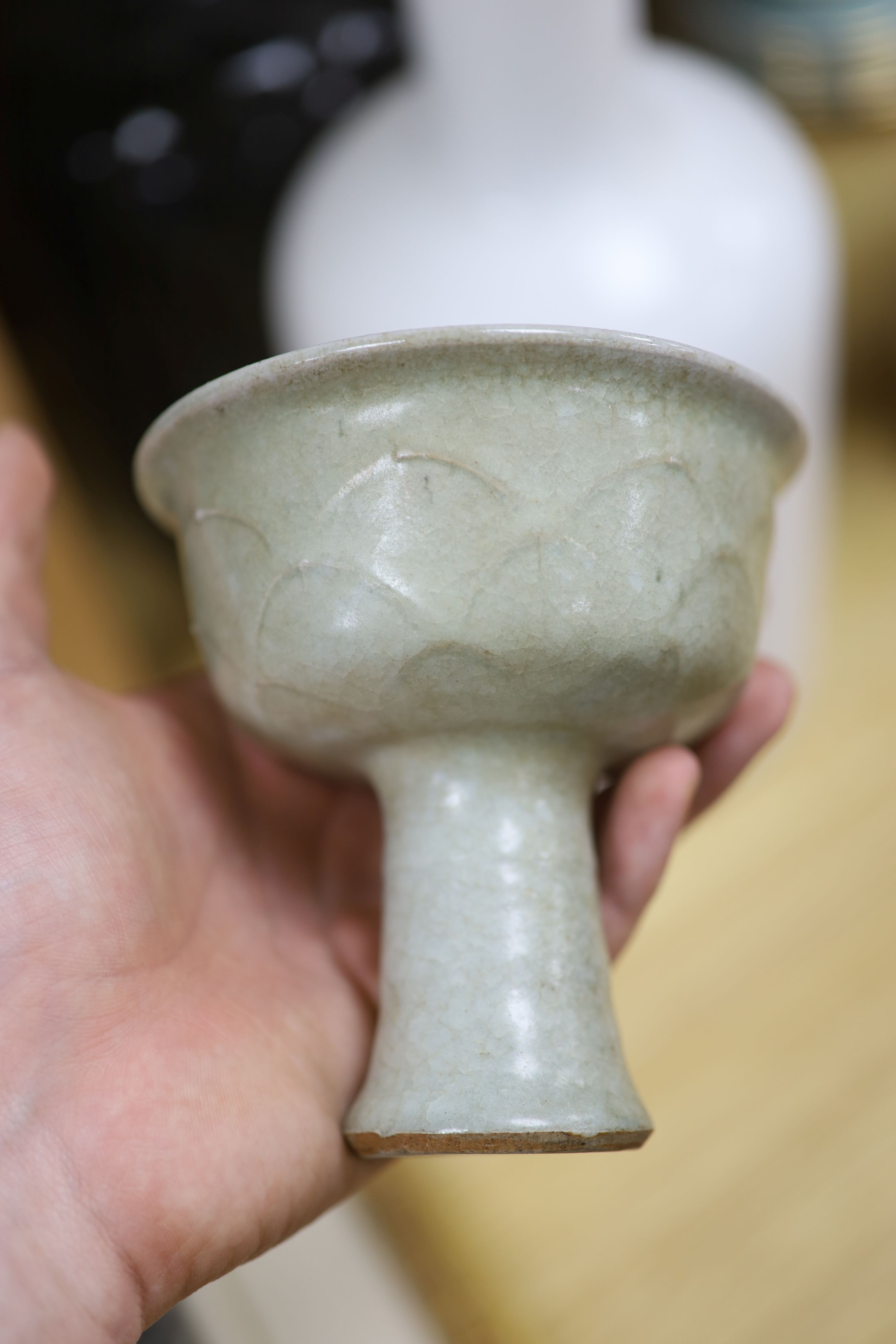 A Chinese blue and white bowl, diameter 15cm, a tea bowl and saucer, a crackleglaze shell dish and a celadon glazed stem cup